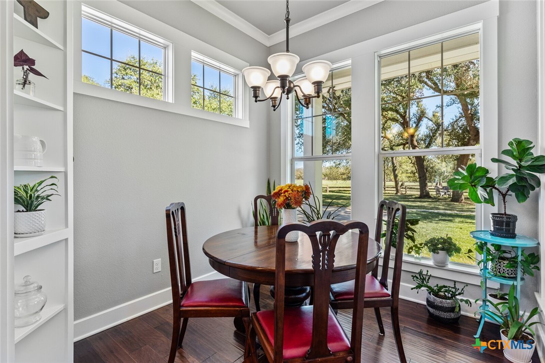 8355 Poison Oak Road, Unit H Temple, TX 76502 - Photo 19 of 48 a view of a dining room with furniture window and wooden floor