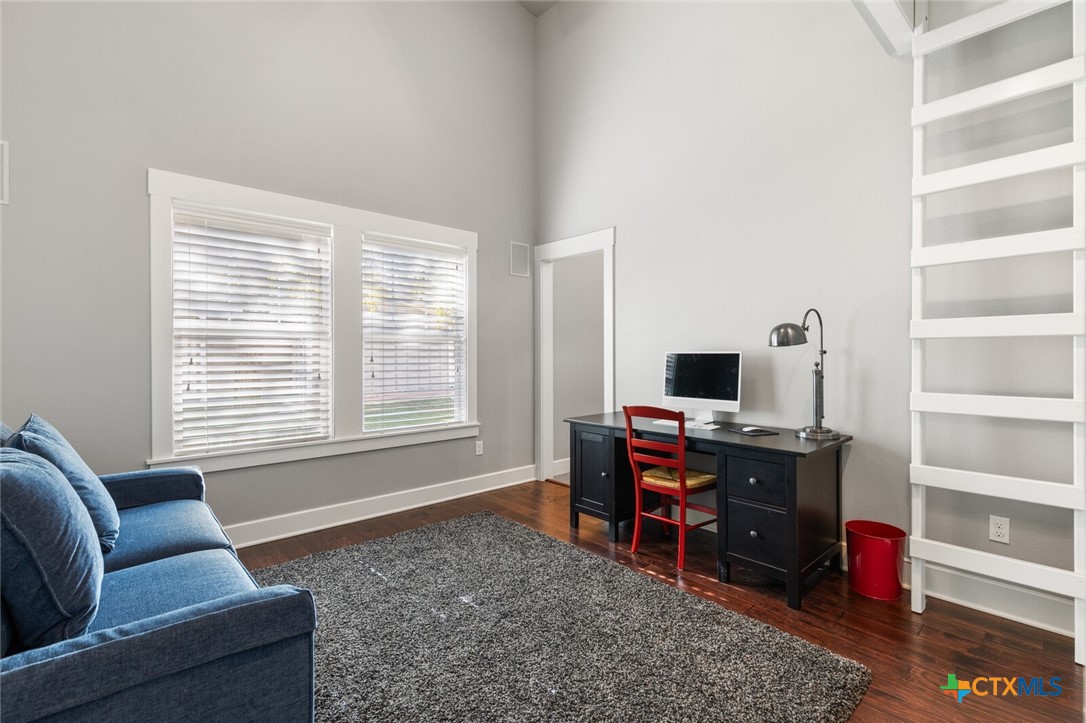 8355 Poison Oak Road, Unit H Temple, TX 76502 - Photo 30 of 48 a living room with furniture and a flat screen tv