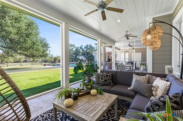 a outdoor living space with furniture and a garden