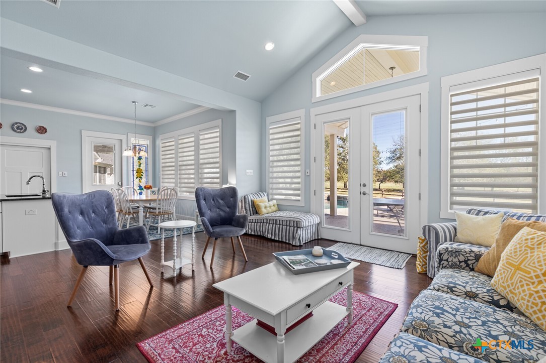 8355 Poison Oak Road, Unit H Temple, TX 76502 - Photo 37 of 48 a living room with furniture and wooden floor