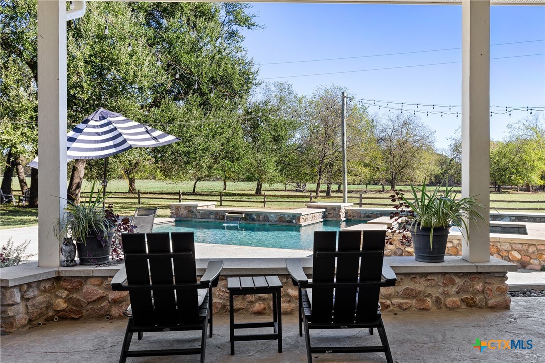 8355 Poison Oak Road, Unit H Temple, TX 76502 - Photo 43 of 48 a view of a patio with table and chairs and potted plants