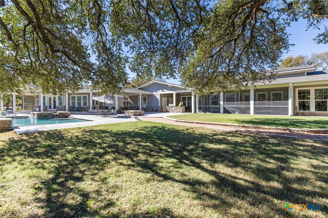 8355 Poison Oak Road, Unit H Temple, TX 76502 - Photo 45 of 48 a front view of a building with a garden