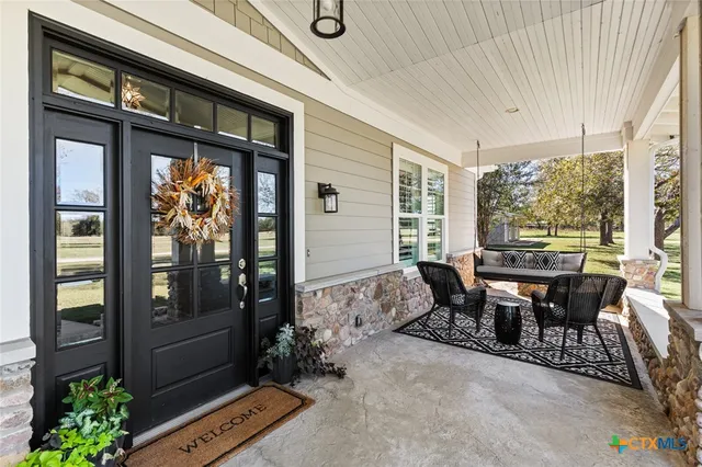 a dining room with furniture and window