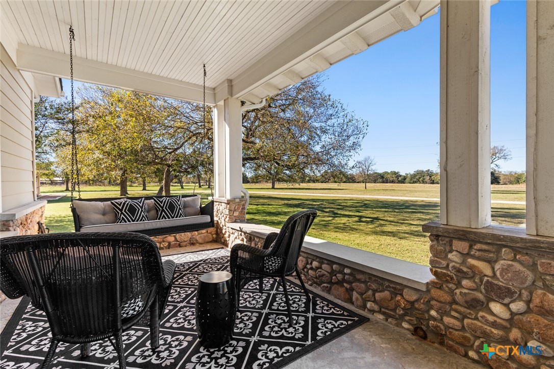 8355 Poison Oak Road, Unit H Temple, TX 76502 - Photo 8 of 48 a view of a balcony with lake view and a potted plant