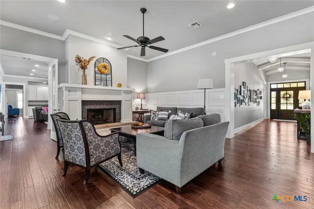 a living room with furniture and a fireplace