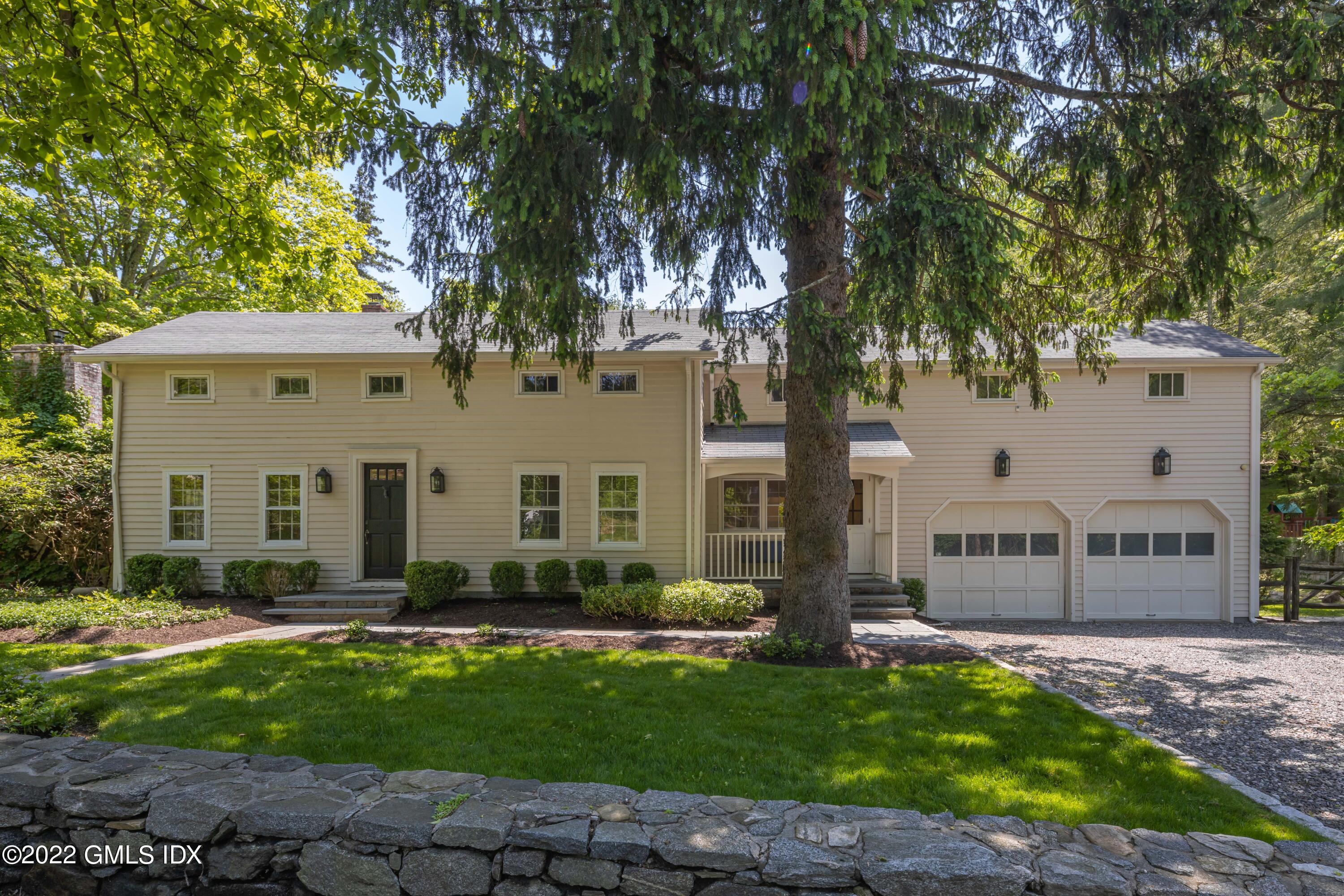 324 Haviland Road Stamford, CT 06903 - Photo 1 of 40 a front view of a house with a yard
