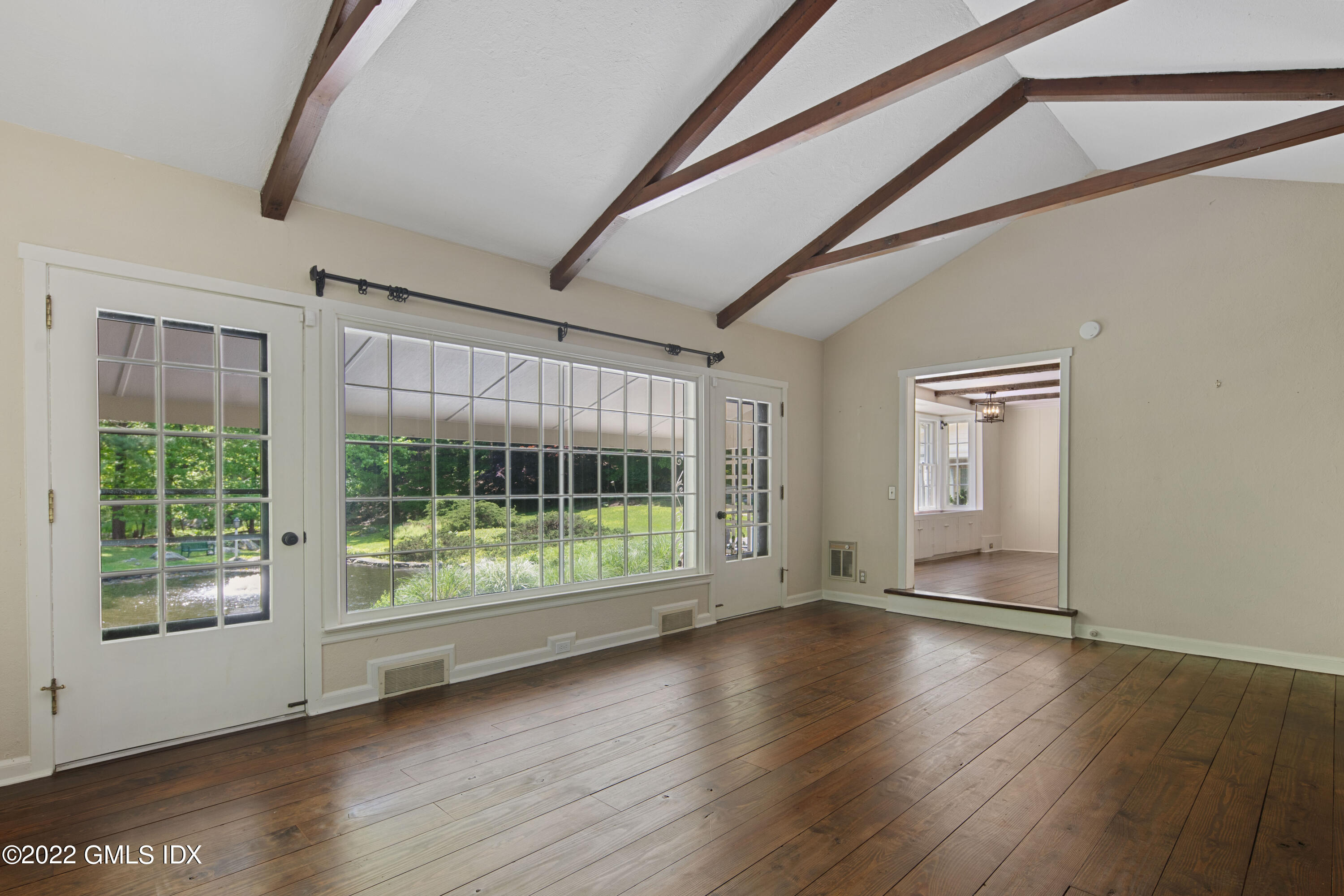 324 Haviland Road Stamford, CT 06903 - Photo 13 of 40 a view of room with window and wooden floor
