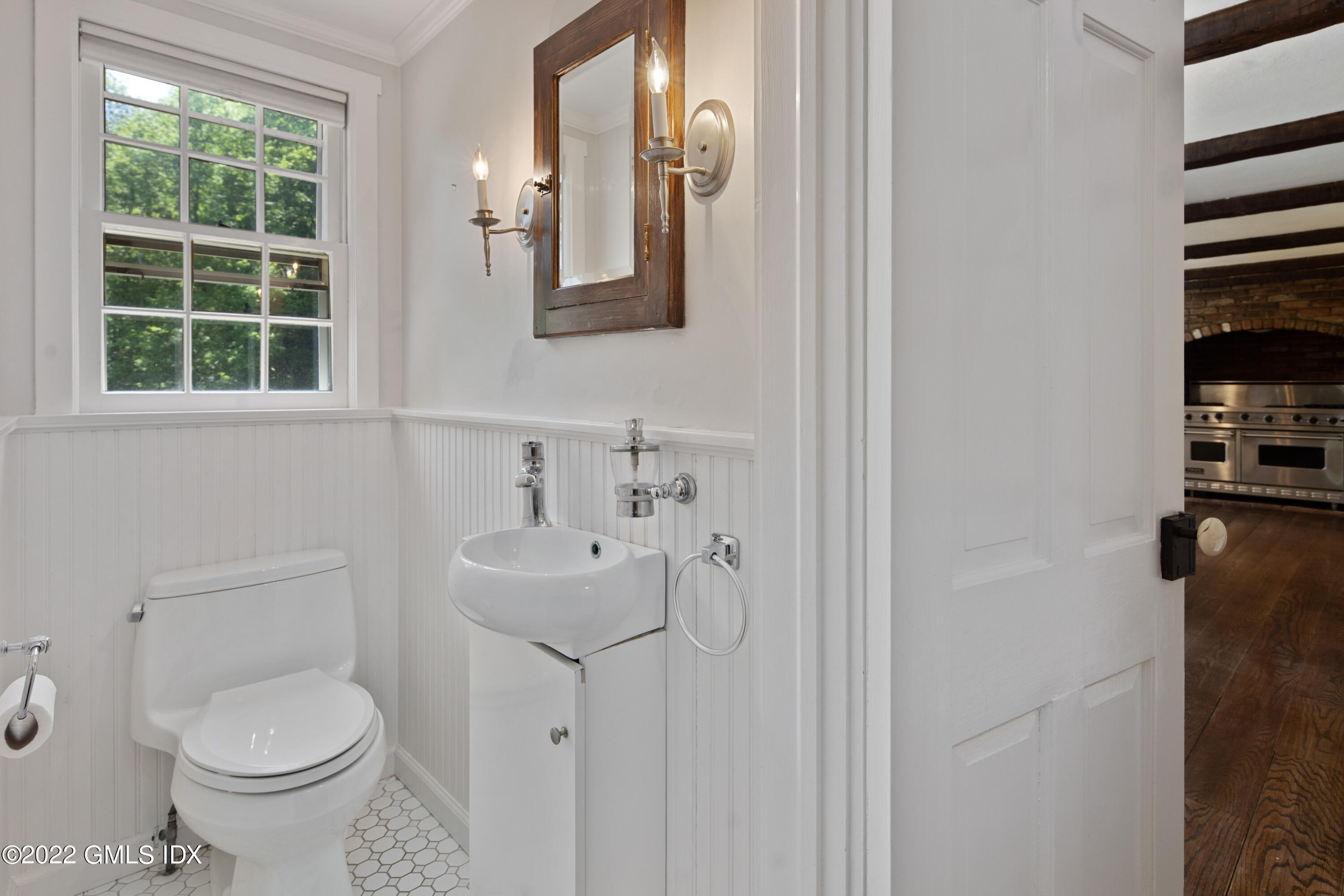 324 Haviland Road Stamford, CT 06903 - Photo 15 of 40 a bathroom with a toilet sink and mirror