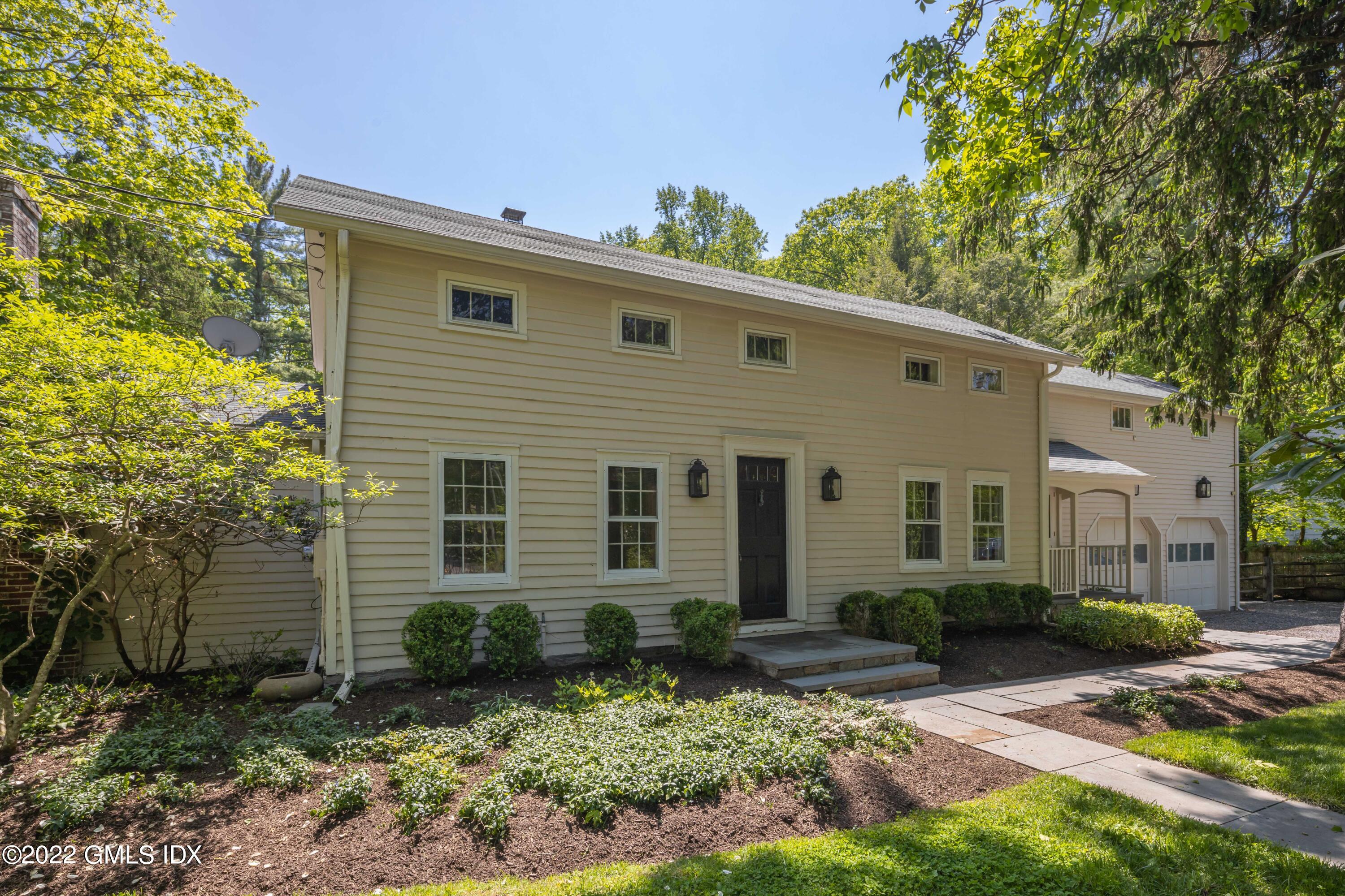 324 Haviland Road Stamford, CT 06903 - Photo 2 of 40 a front view of a house with garden