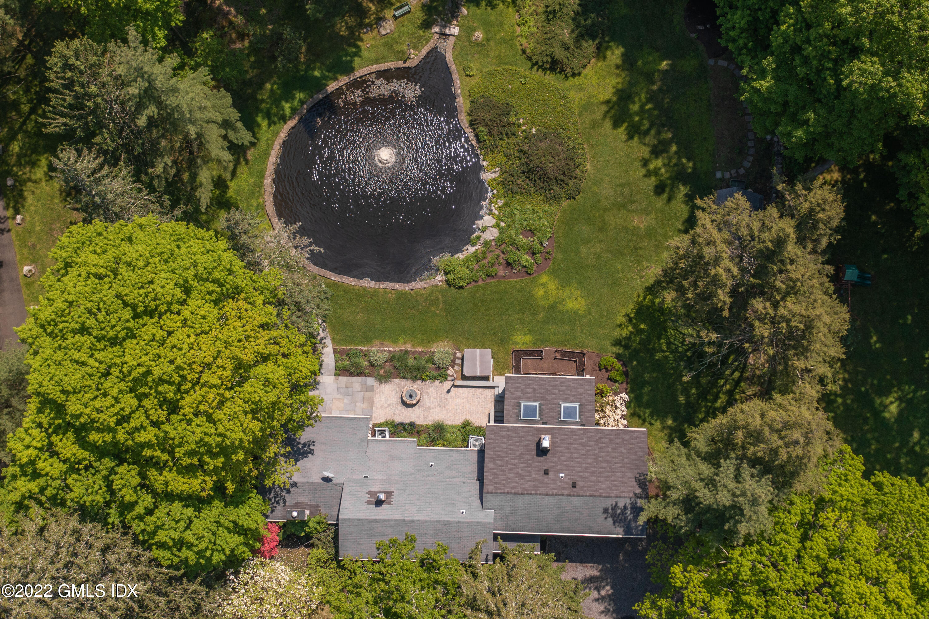 324 Haviland Road Stamford, CT 06903 - Photo 29 of 40 an aerial view of a house with a yard and garden