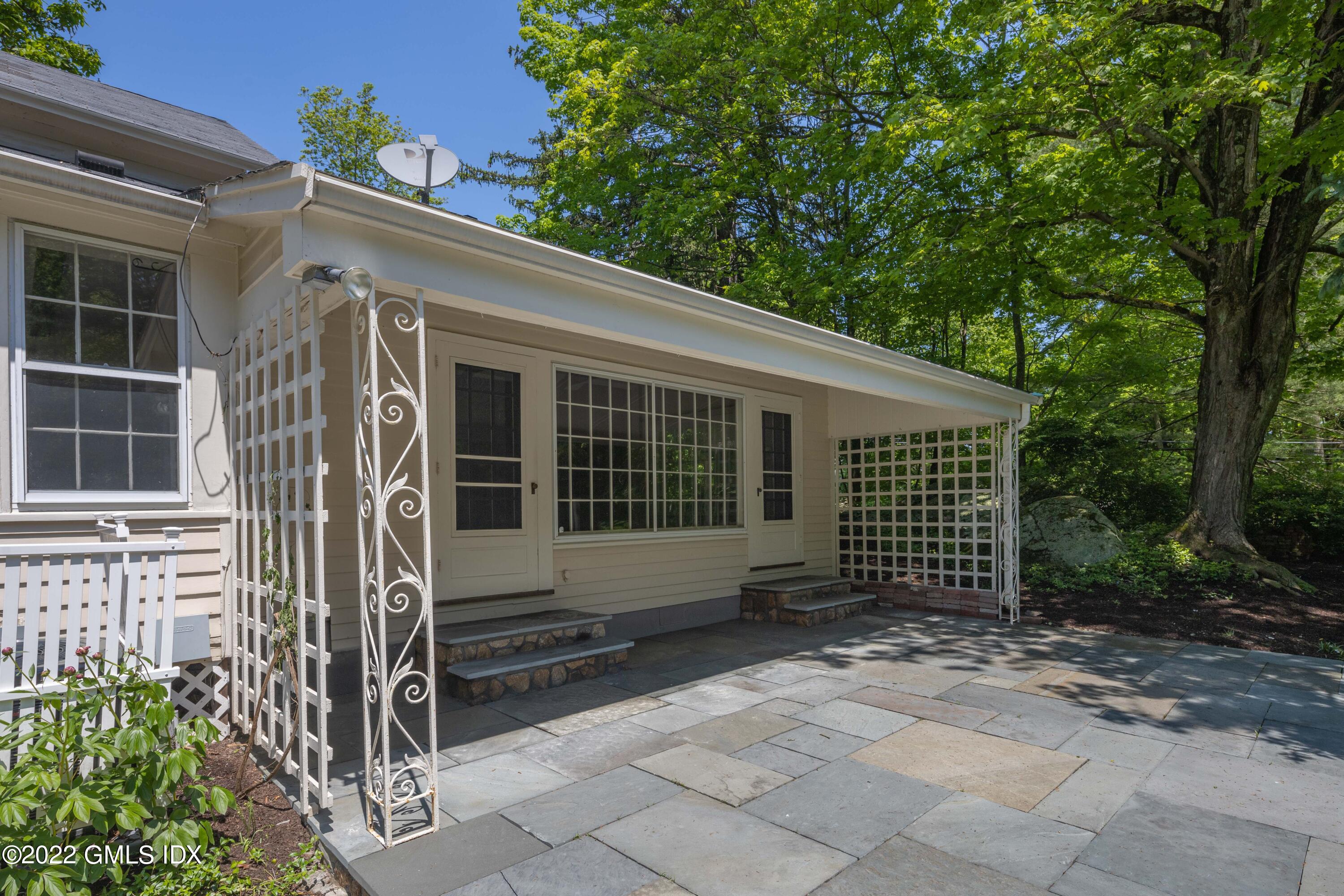 324 Haviland Road Stamford, CT 06903 - Photo 30 of 40 a front view of a house with garden