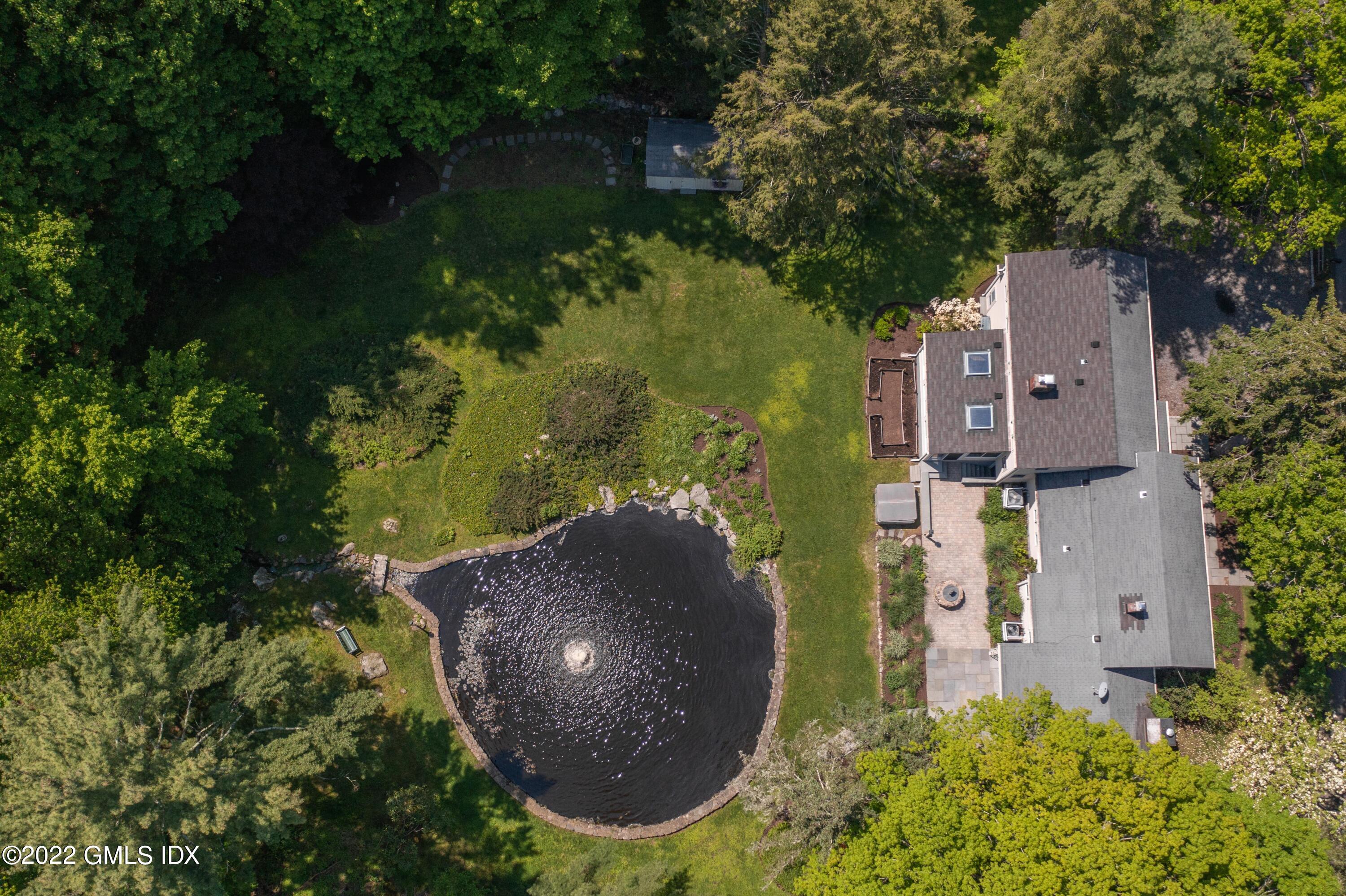 324 Haviland Road Stamford, CT 06903 - Photo 35 of 40 an aerial view of a house with outdoor space and a lake view in back