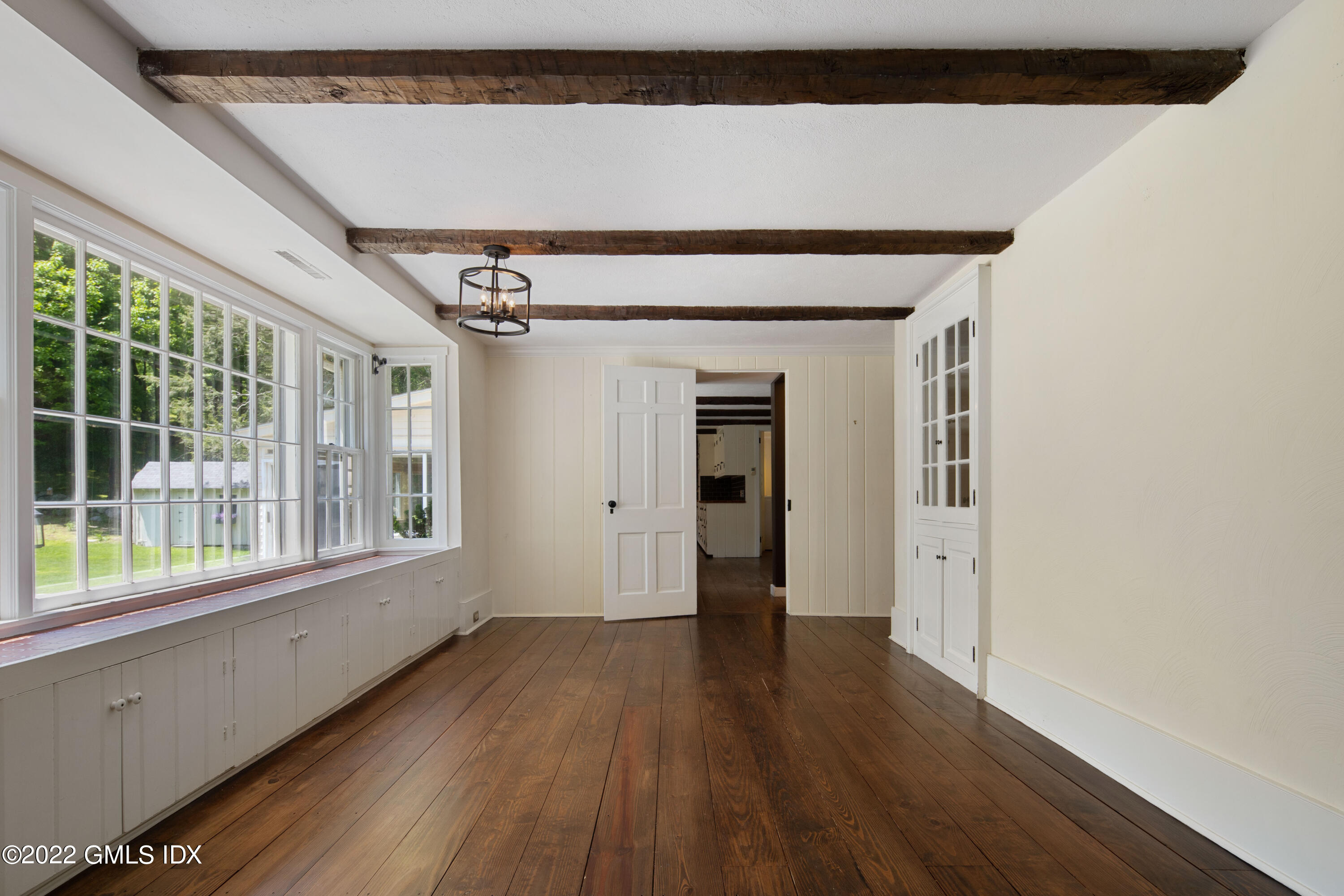 324 Haviland Road Stamford, CT 06903 - Photo 10 of 40 a view of empty room with wooden floor and fan