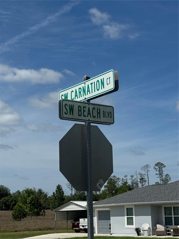 Southwest Beach Boulevard Dunnellon, FL 34433 - Photo 5 of 6 a street sign on a pole on a street