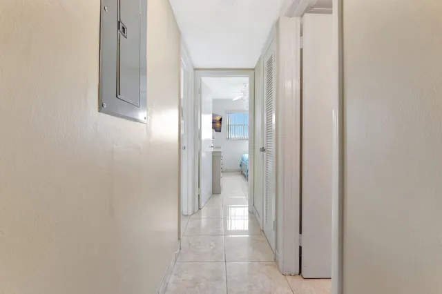 a en suite bathroom with a granite countertop sink and a mirror