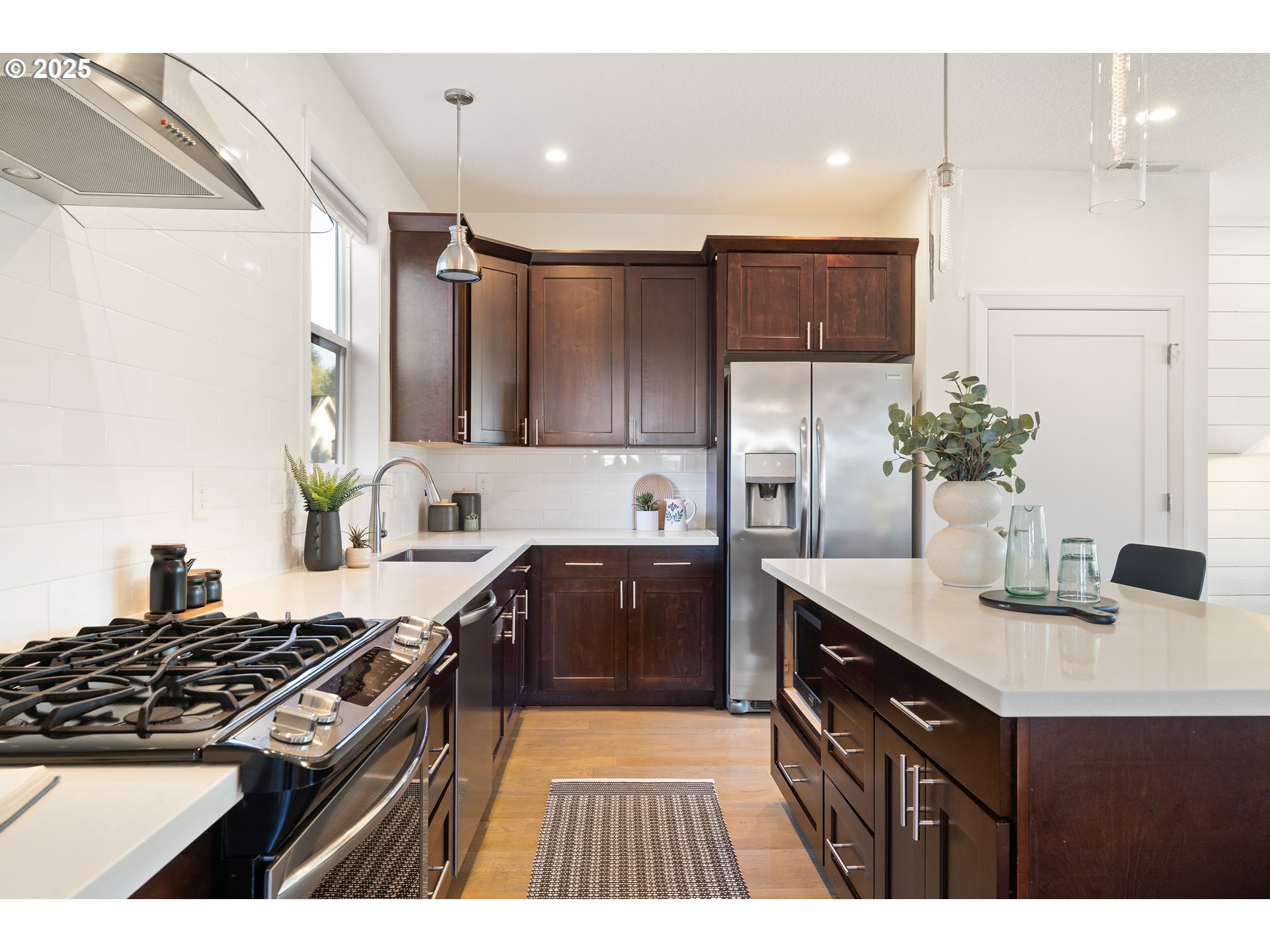 4735 Southeast Bush Street Portland, OR 97206 - Photo 13 of 47 a kitchen with a sink stove and refrigerator