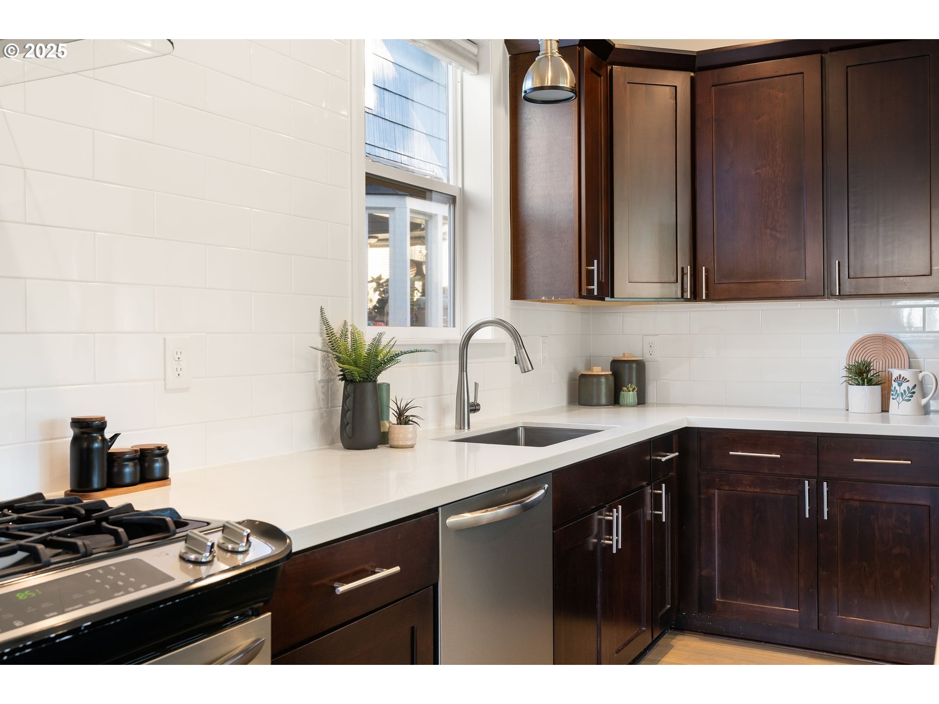 4735 Southeast Bush Street Portland, OR 97206 - Photo 15 of 47 a kitchen with a sink and cabinets