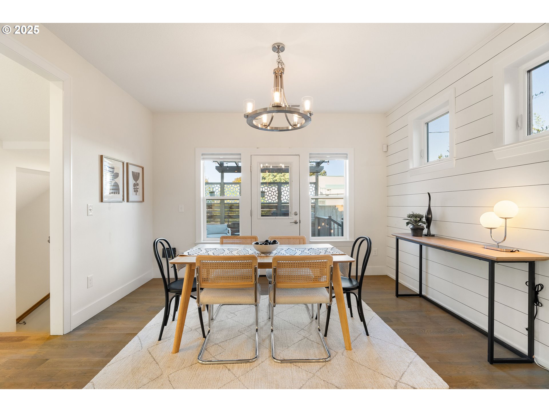 4735 Southeast Bush Street Portland, OR 97206 - Photo 17 of 47 a view of a dining room with furniture window and wooden floor