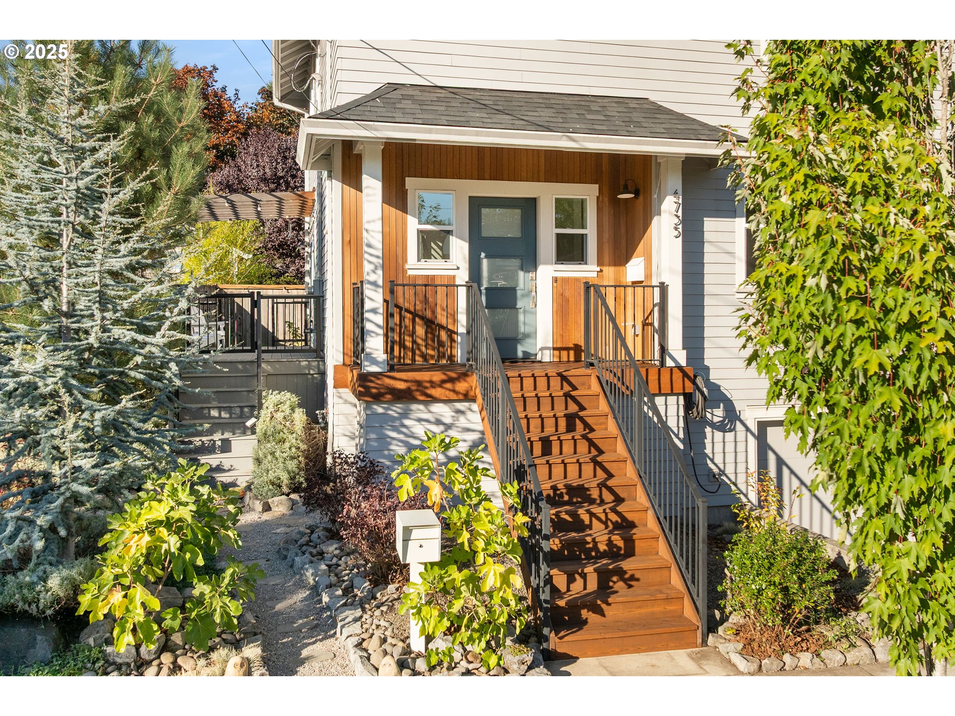 4735 Southeast Bush Street Portland, OR 97206 - Photo 2 of 47 front view of a house with a small yard