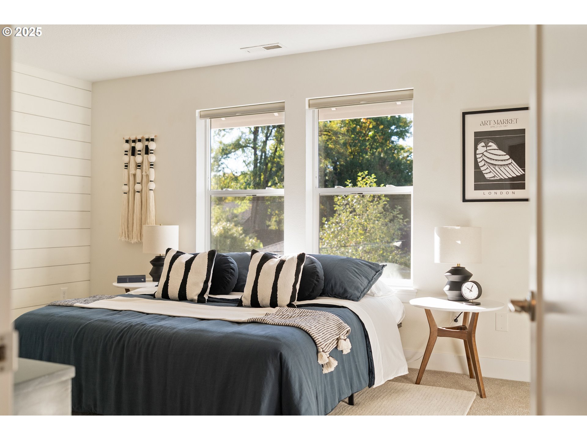 4735 Southeast Bush Street Portland, OR 97206 - Photo 21 of 47 a bedroom with a bed and a window