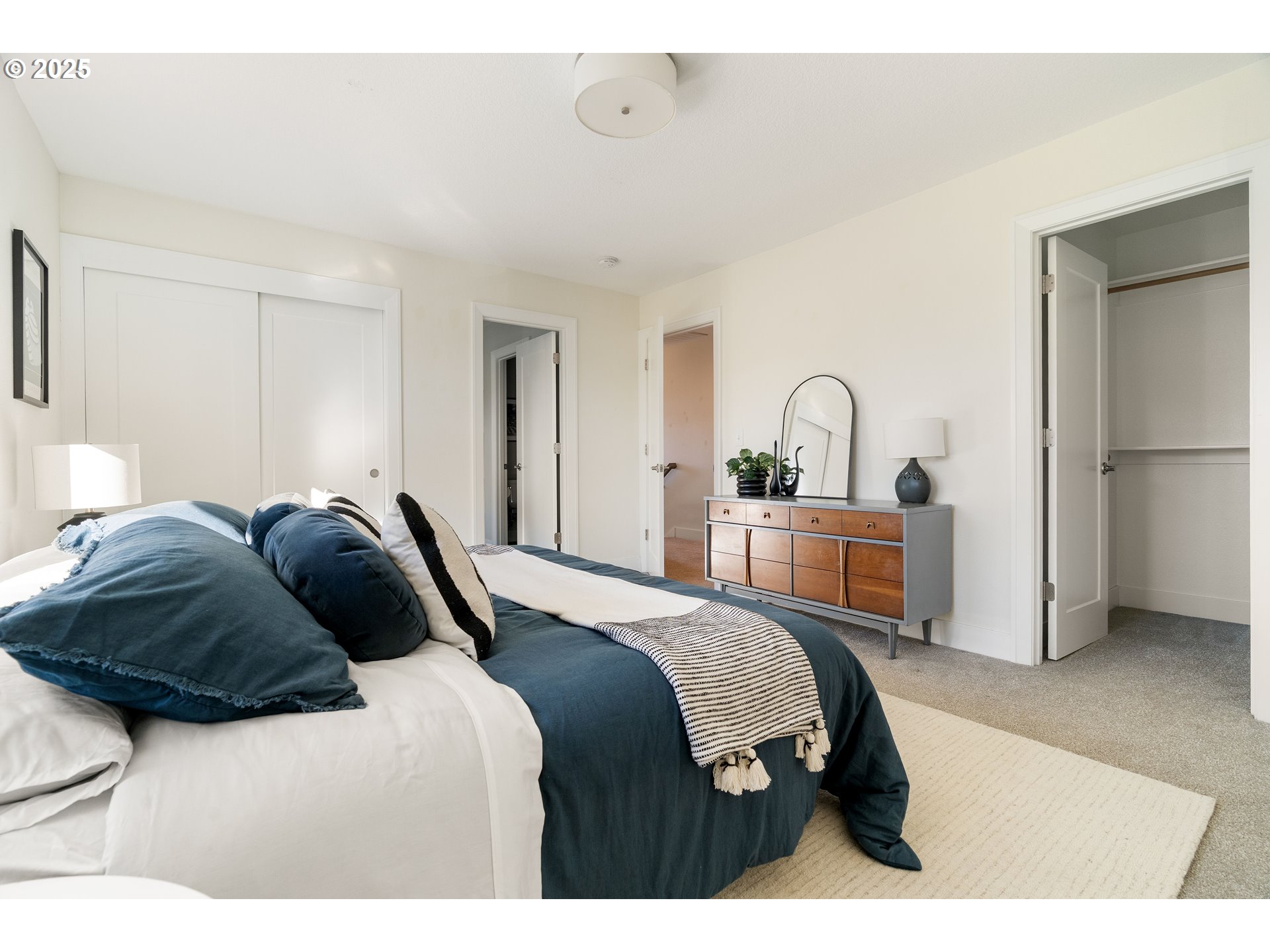 4735 Southeast Bush Street Portland, OR 97206 - Photo 22 of 47 a bedroom with a bed and a refrigerator