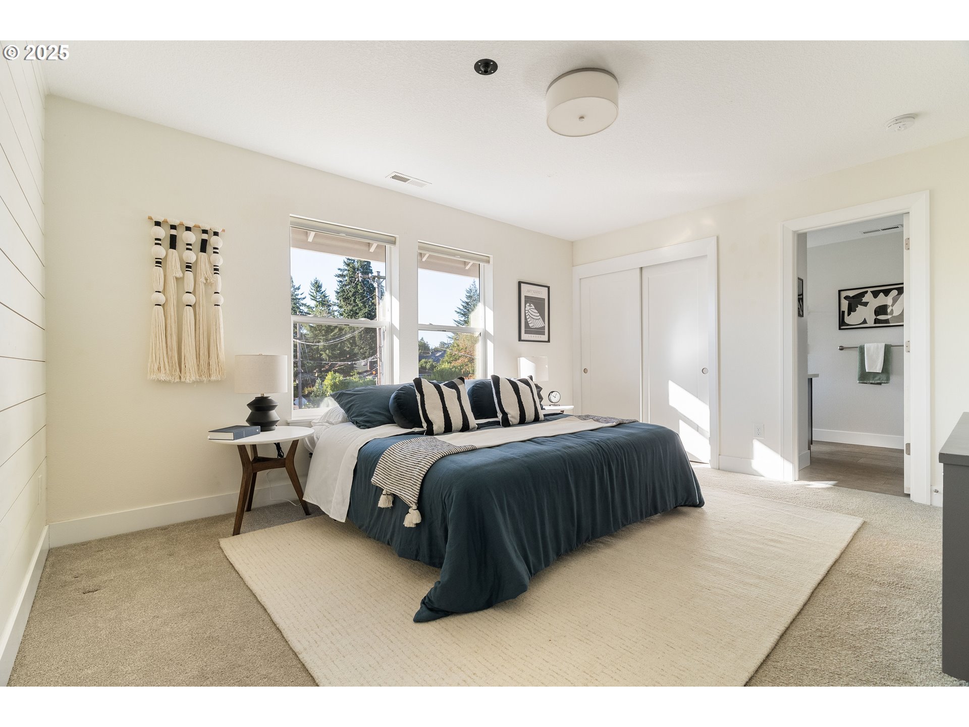 4735 Southeast Bush Street Portland, OR 97206 - Photo 24 of 47 a bedroom with a bed and a window
