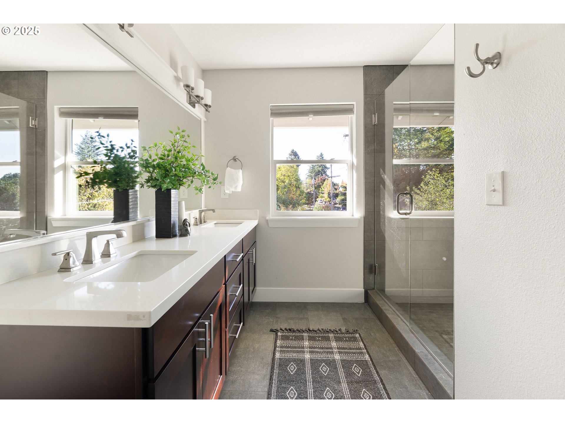4735 Southeast Bush Street Portland, OR 97206 - Photo 25 of 47 a bathroom with a sink and a mirror