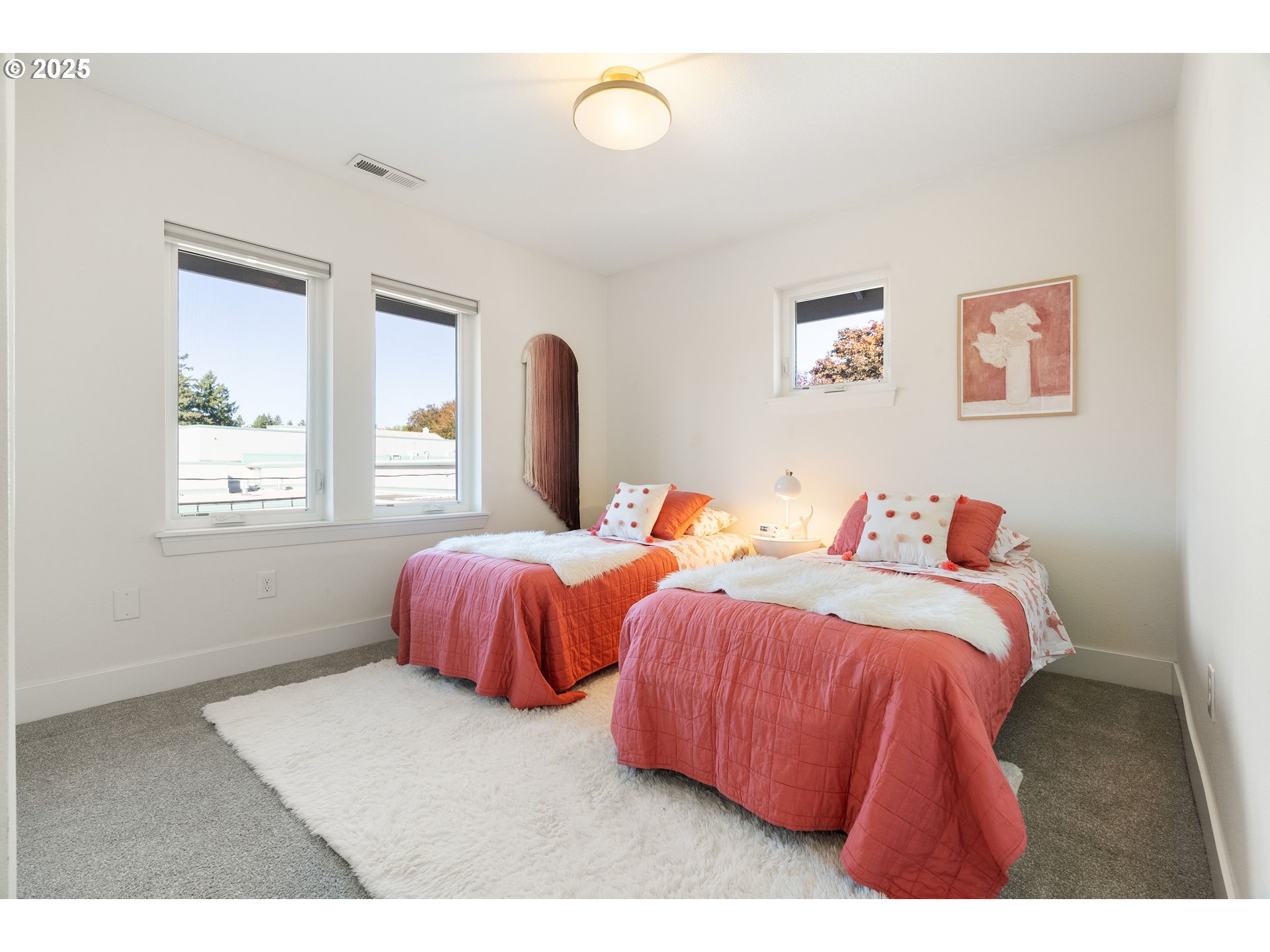4735 Southeast Bush Street Portland, OR 97206 - Photo 29 of 47 a bedroom with two beds and a window