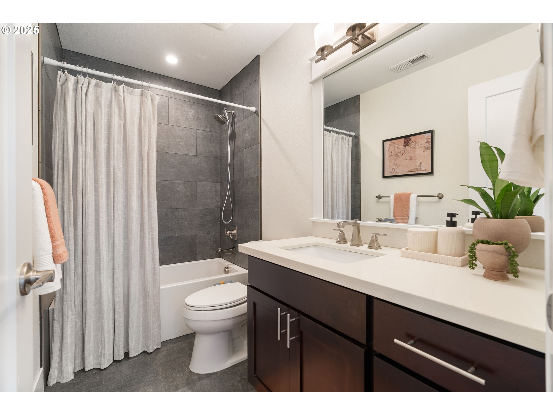 4735 Southeast Bush Street Portland, OR 97206 - Photo 31 of 47 a bathroom with a sink a toilet and shower