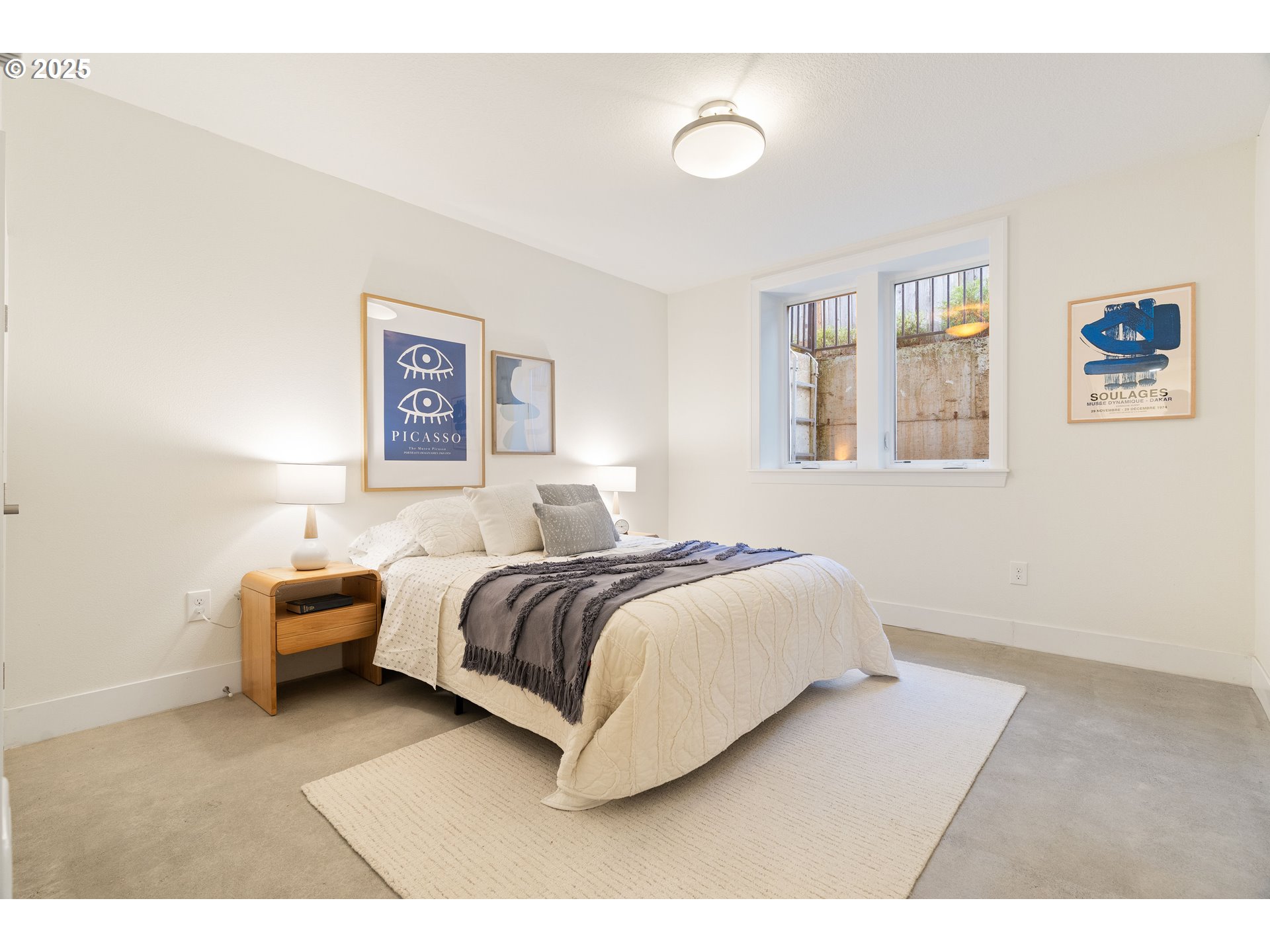 4735 Southeast Bush Street Portland, OR 97206 - Photo 35 of 47 a bedroom with a bed couch and a window
