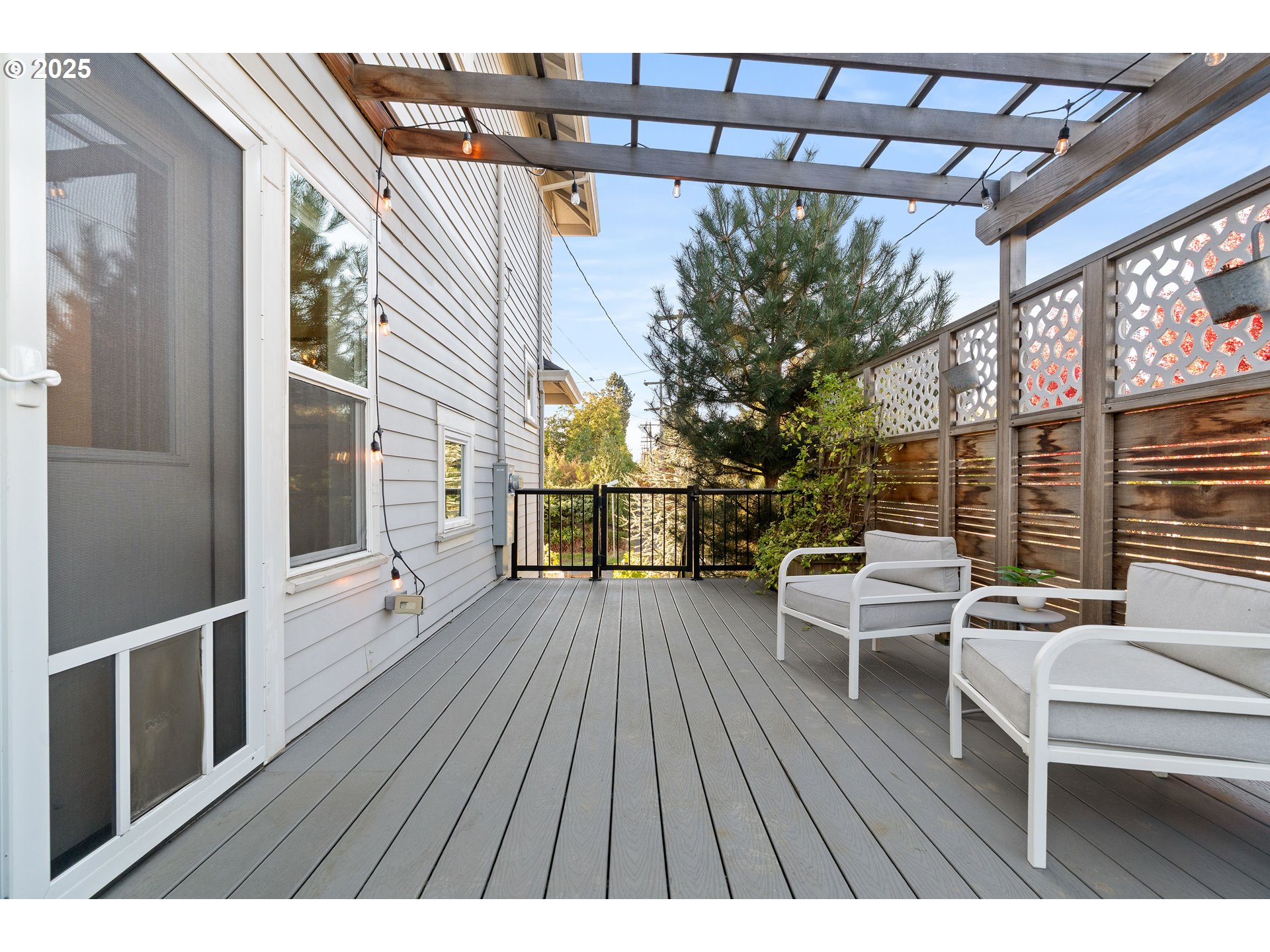 4735 Southeast Bush Street Portland, OR 97206 - Photo 37 of 47 a balcony with wooden floor and outdoor seating
