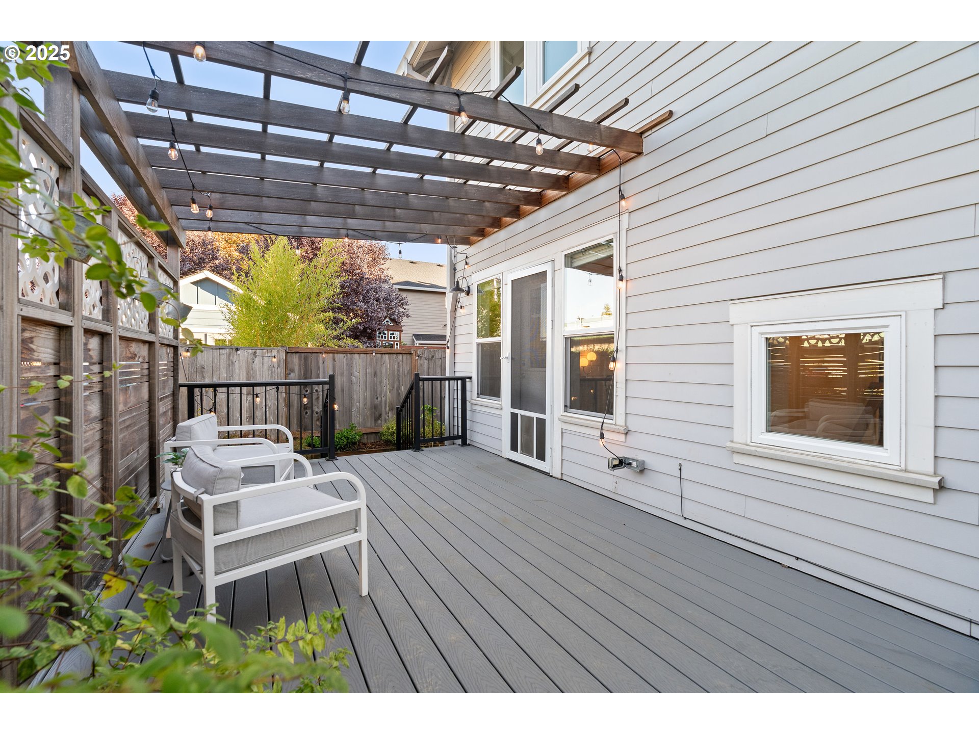 4735 Southeast Bush Street Portland, OR 97206 - Photo 38 of 47 a view of a deck with wooden floor and outdoor seating