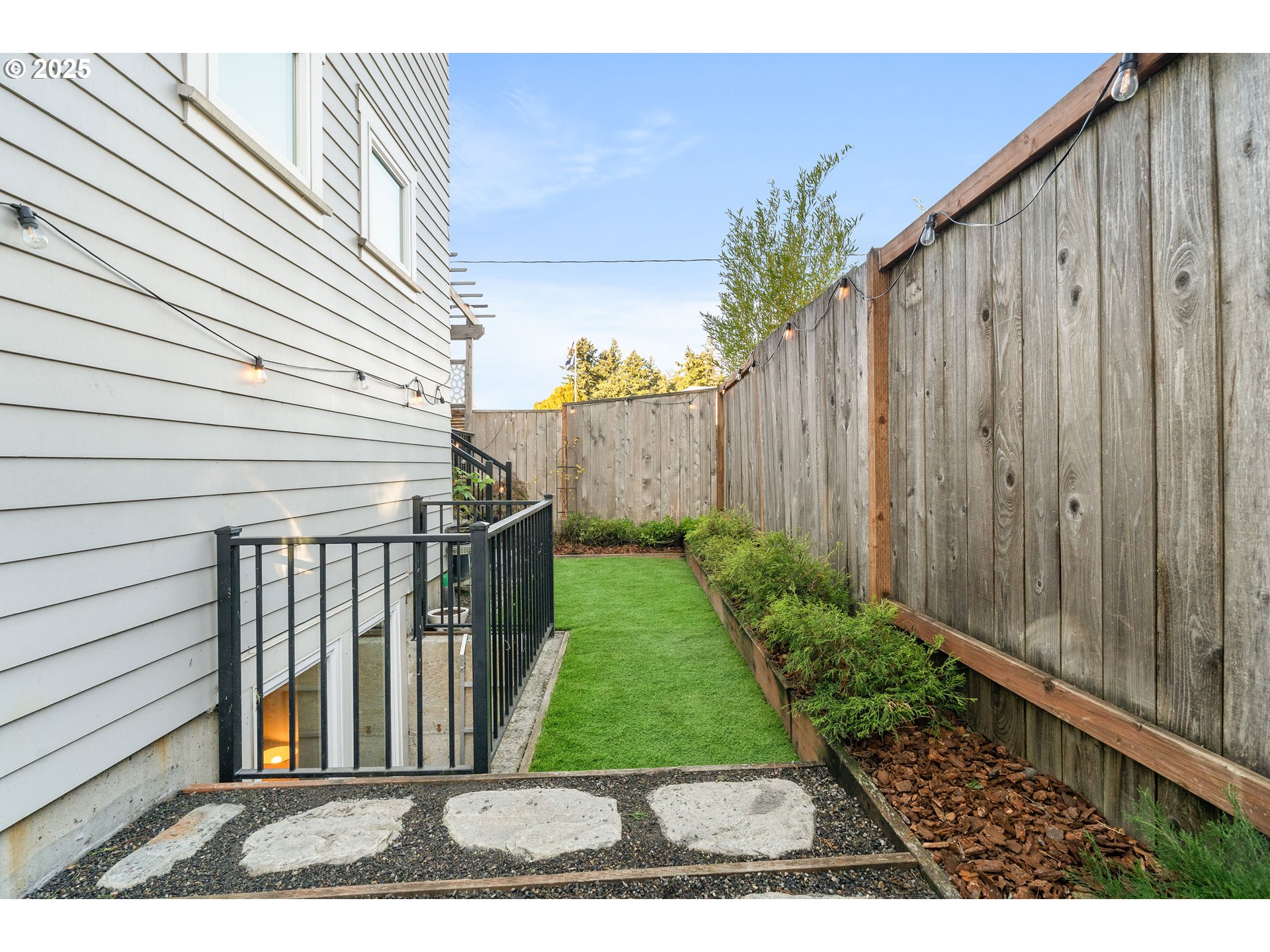 4735 Southeast Bush Street Portland, OR 97206 - Photo 42 of 47 a view of a backyard with pathway