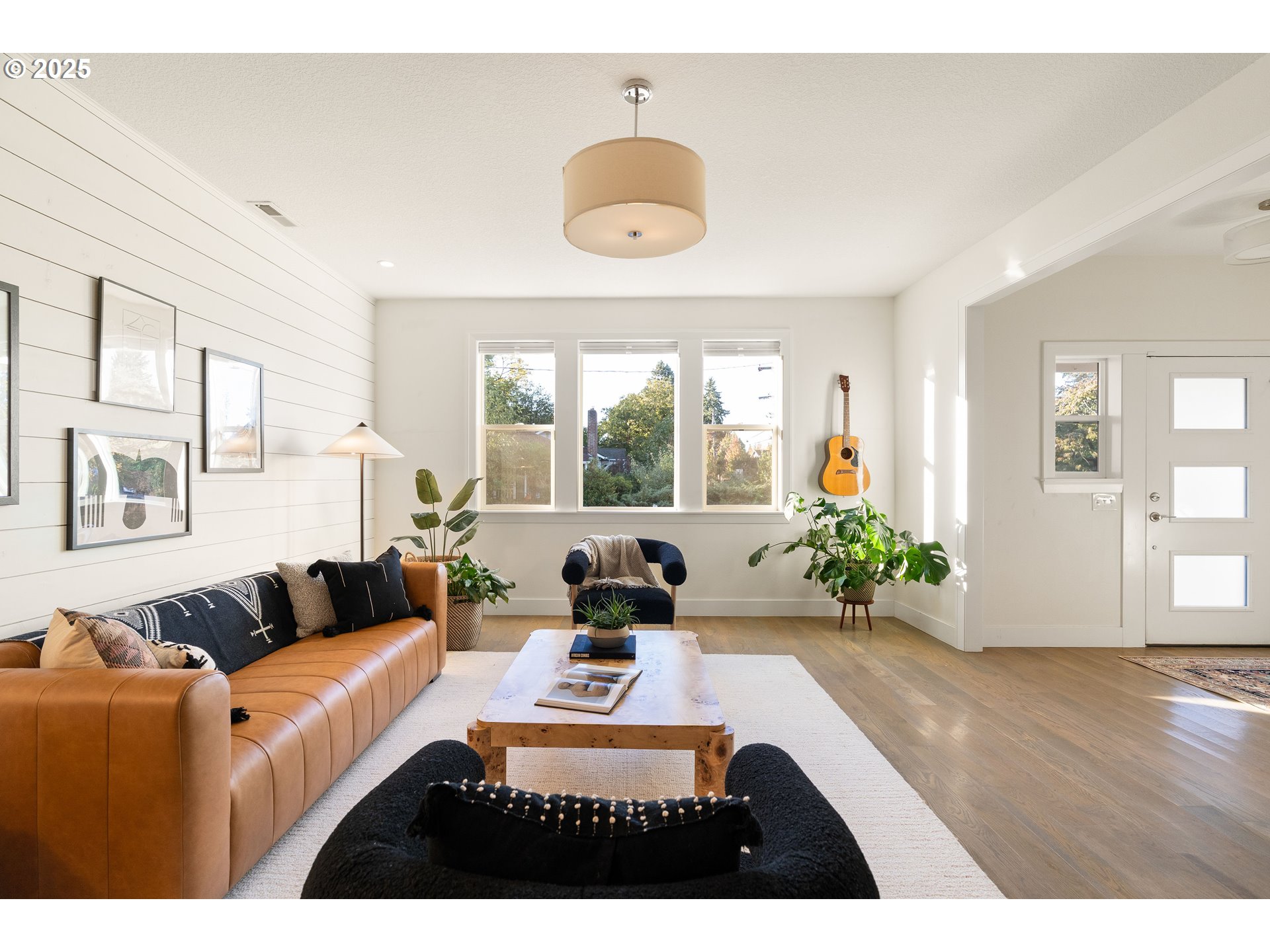 4735 Southeast Bush Street Portland, OR 97206 - Photo 9 of 47 a living room with furniture and a large window