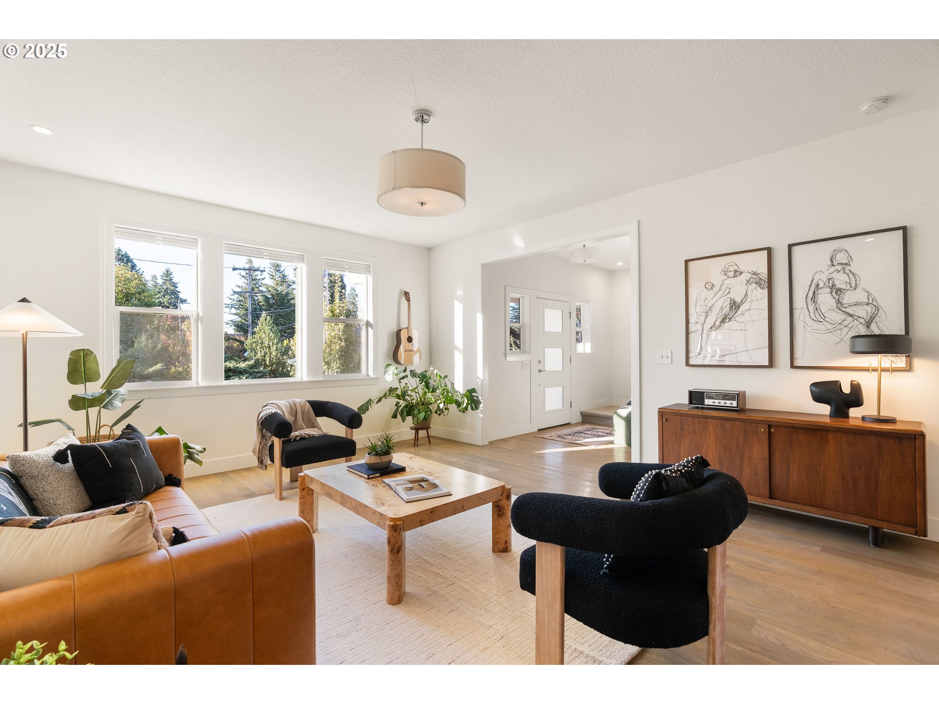 4735 Southeast Bush Street Portland, OR 97206 - Photo 10 of 47 a living room with furniture and a large window