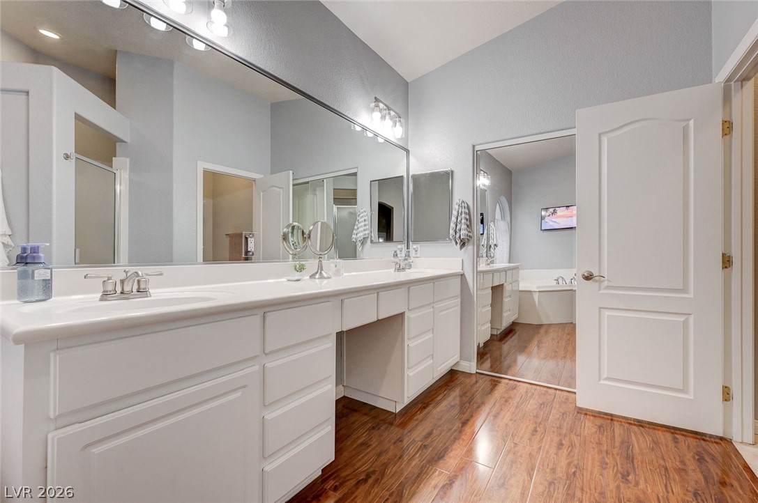 1604 Cattle Ranch Place Henderson, NV 89002 - Photo 41 of 99 Ample counter space and dual sinks define this bright, functional primary bathroom.