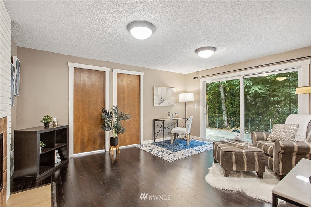 13820 Southeast 141st Street Renton, WA 98059 - Photo 14 of 16 a living room with furniture and a large window