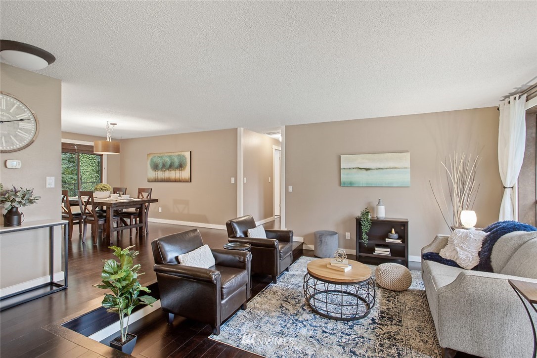 13820 Southeast 141st Street Renton, WA 98059 - Photo 3 of 16 a living room with furniture and a large window
