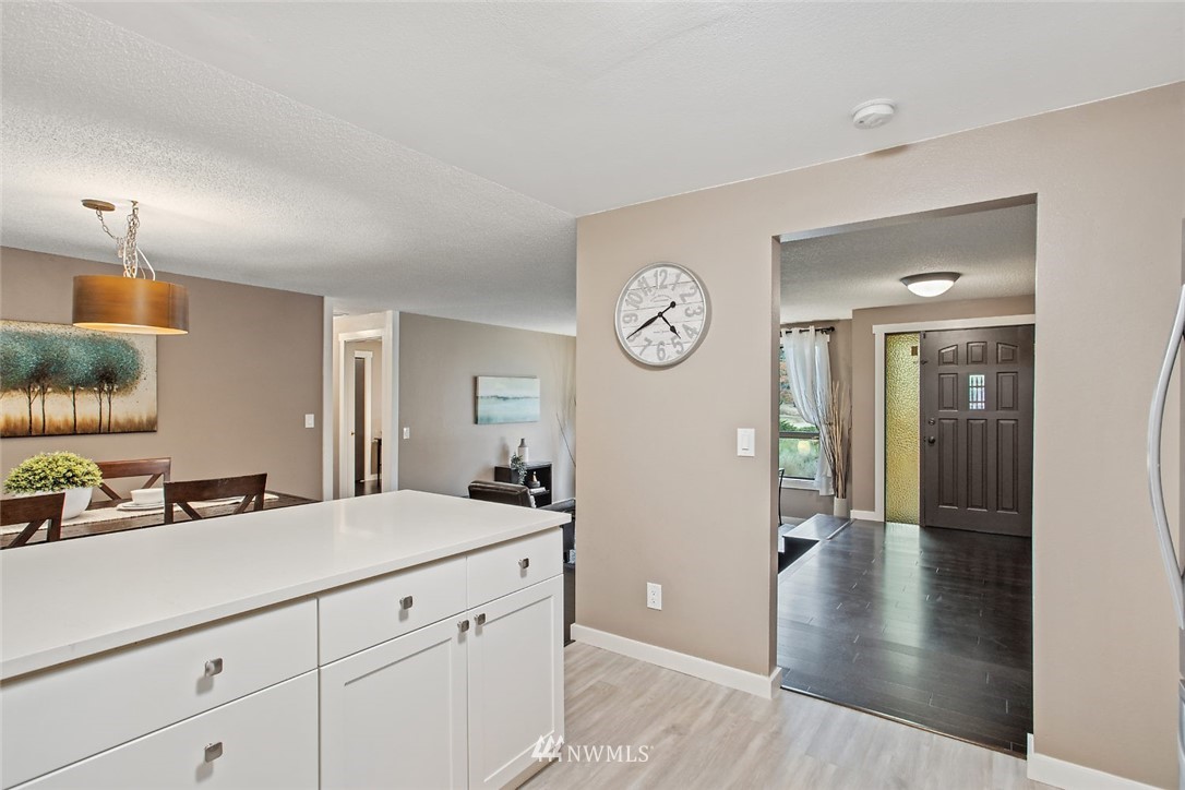 13820 Southeast 141st Street Renton, WA 98059 - Photo 8 of 16 a view of a kitchen from the hallway
