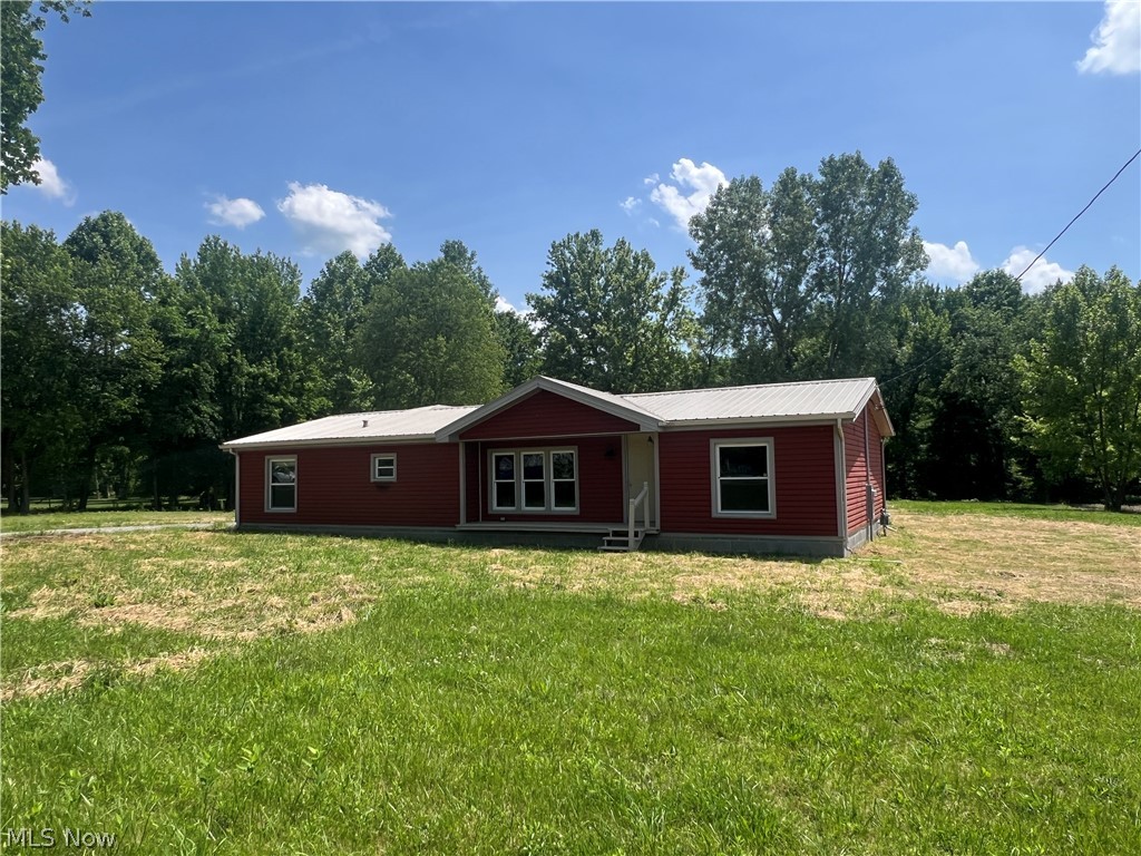 5476 Rutledge Street Southeast Dennison, OH 44621 - Photo 1 of 29 Ranch-style house featuring a front lawn