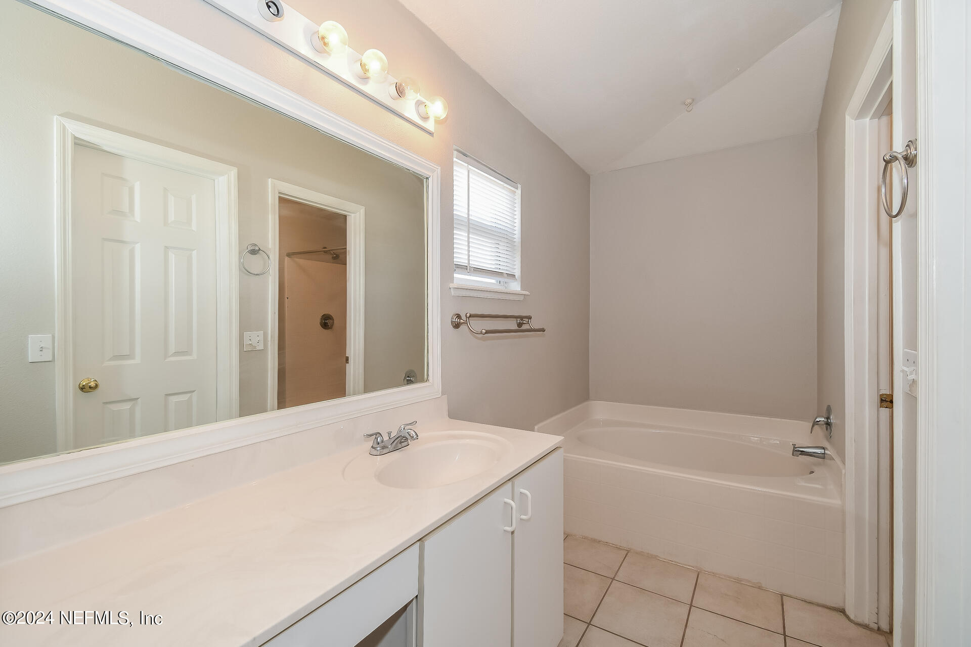 7351 Fox Grove Road Jacksonville, FL 32244 - Photo 12 of 17 a bathroom with a bathtub and a sink