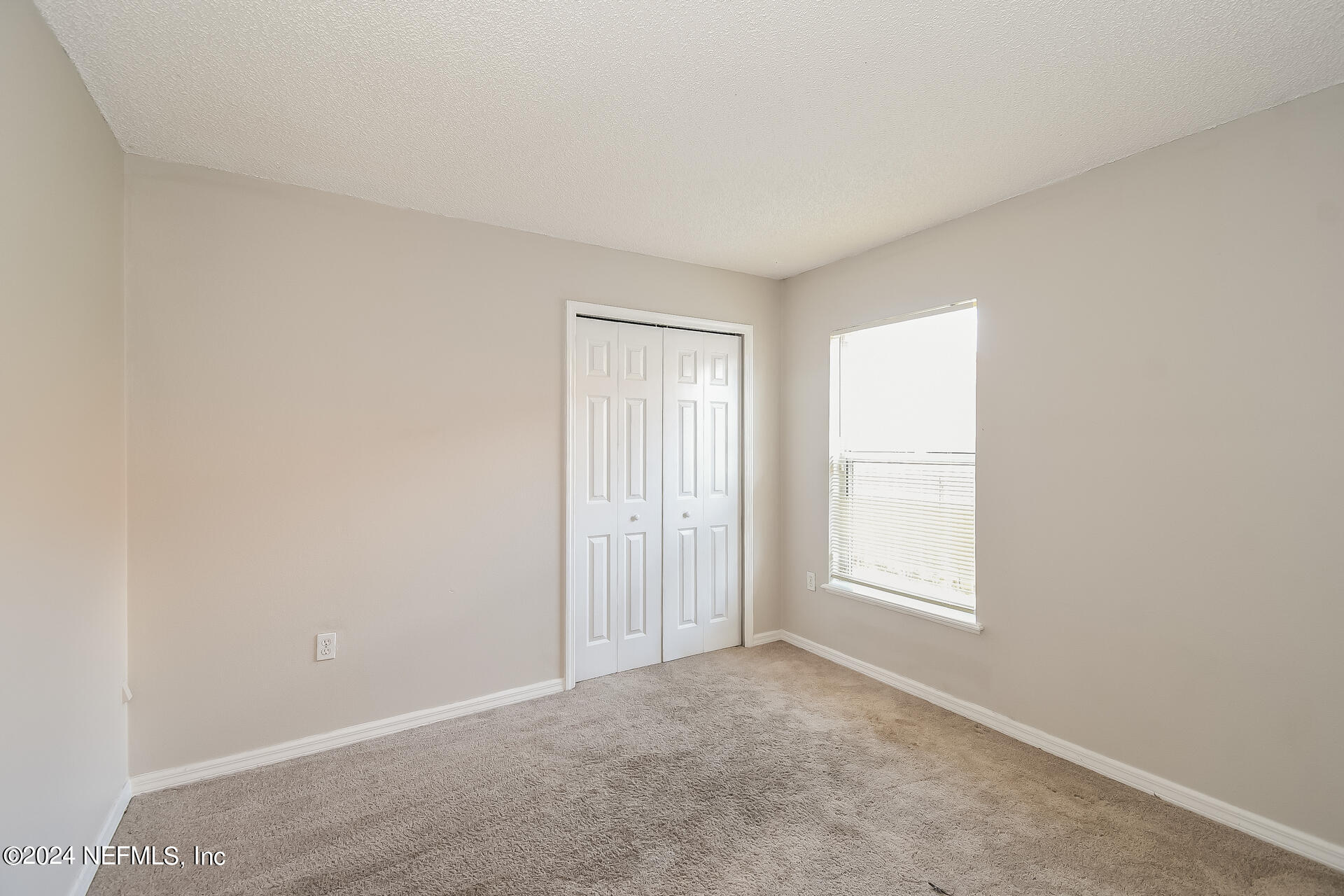 7351 Fox Grove Road Jacksonville, FL 32244 - Photo 14 of 17 an empty room with windows