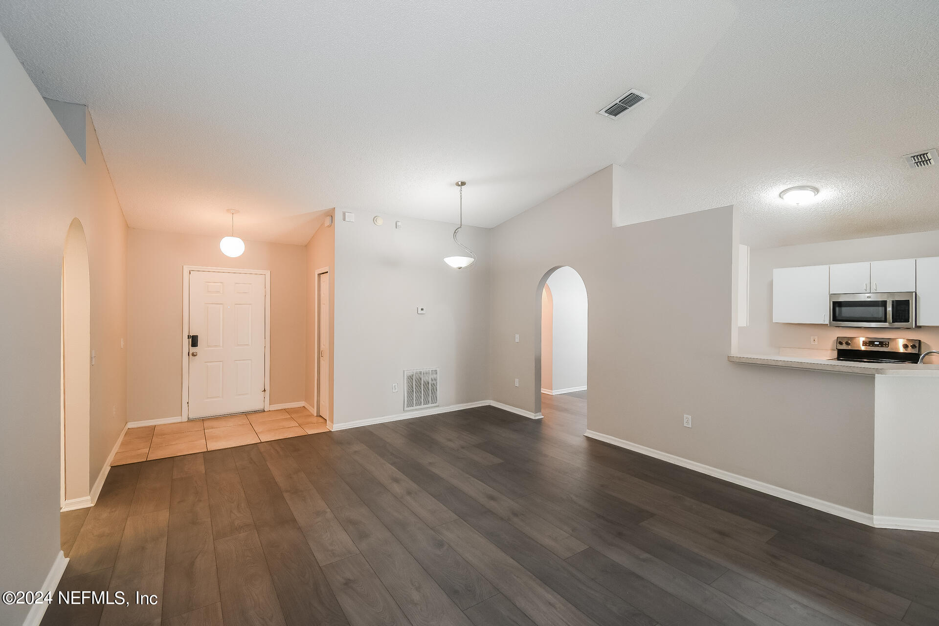 7351 Fox Grove Road Jacksonville, FL 32244 - Photo 3 of 17 a view of a kitchen with a sink and a refrigerator