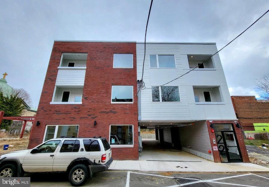 22 East Rittenhouse Street, Unit 3 Philadelphia, PA 19144 - Photo 13 of 13 a front view of a house with parking space