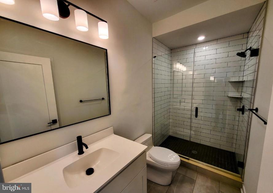 22 East Rittenhouse Street, Unit 3 Philadelphia, PA 19144 - Photo 7 of 13 a bathroom with a sink a toilet and shower