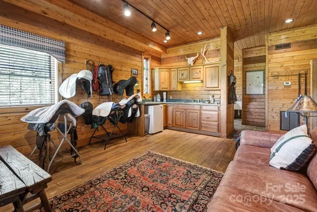 a living room with furniture a rug and a fireplace