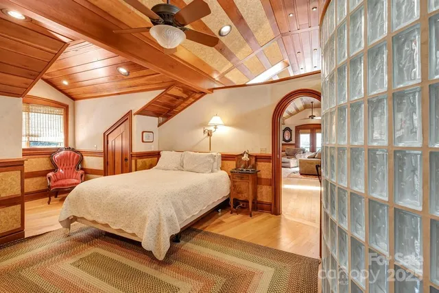 a view of a field with small trees