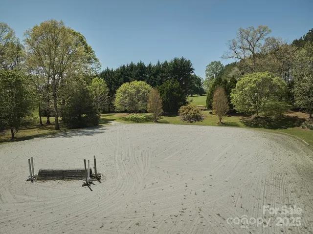 a front view of a house with a garden and yard
