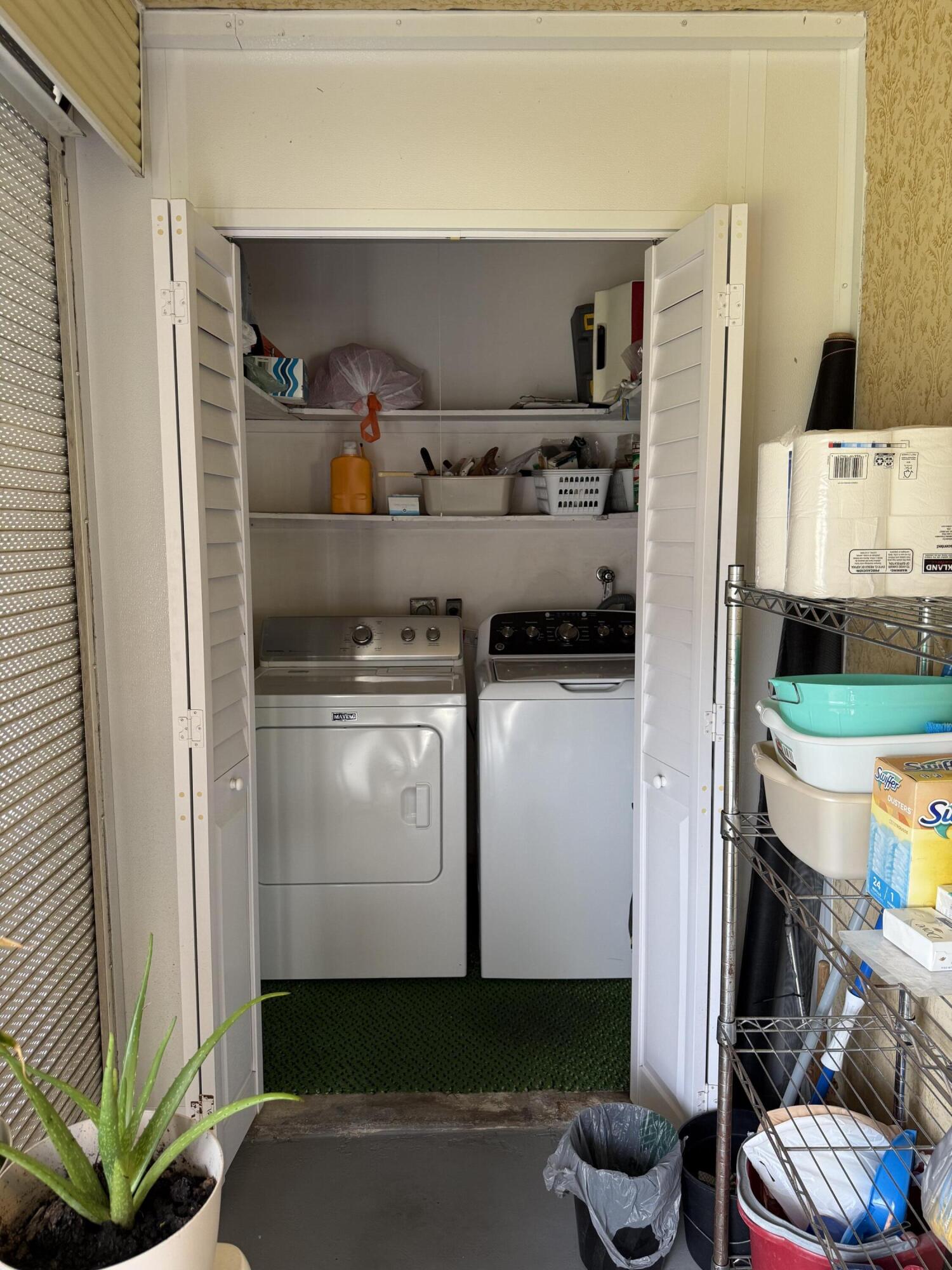 147 Burgandy Way Delray Beach, FL 33484 - Photo 14 of 14 a kitchen with stainless steel appliances a stove and a refrigerator