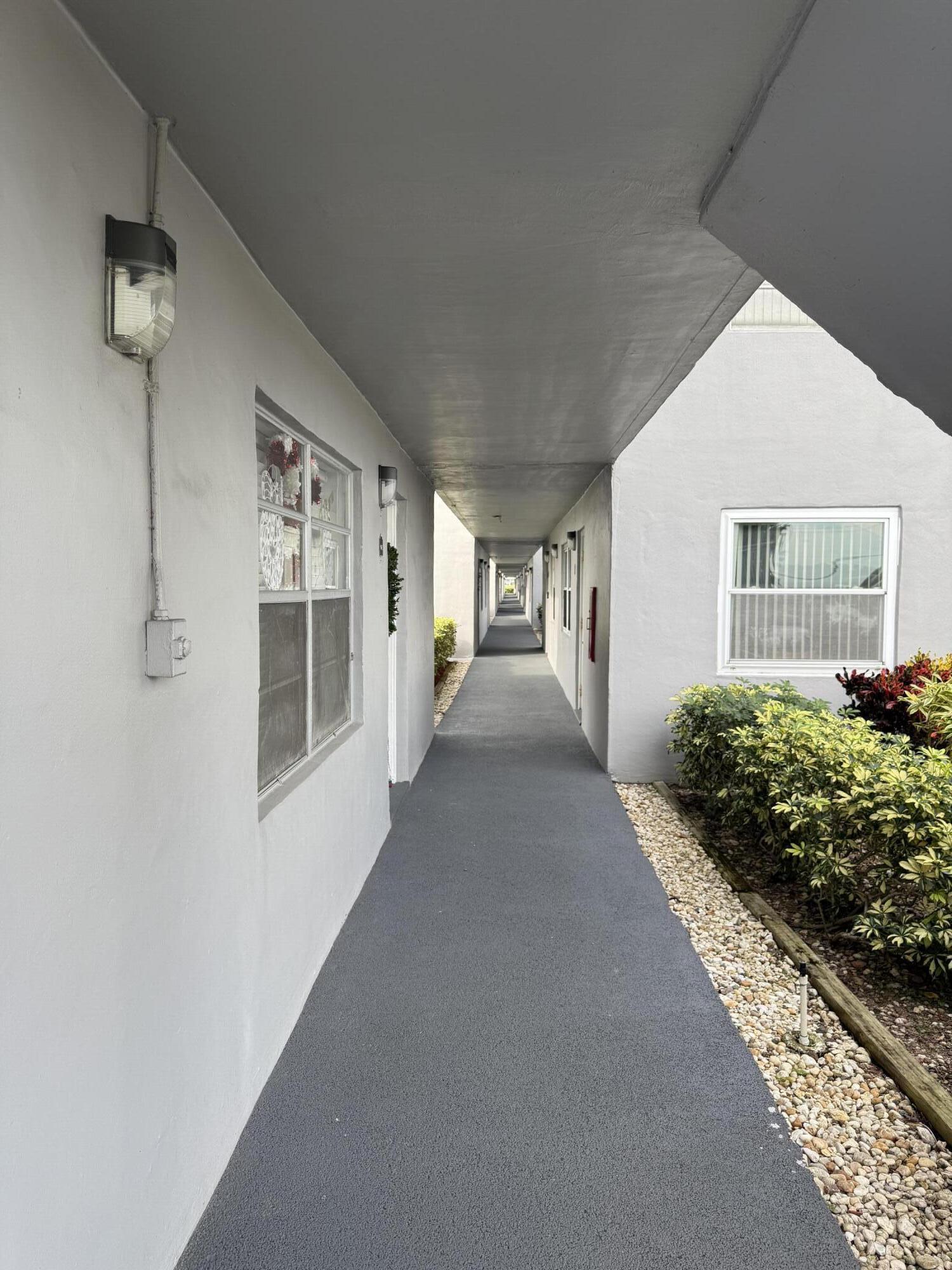 147 Burgandy Way Delray Beach, FL 33484 - Photo 2 of 14 a view of entryway and hall with wooden floor